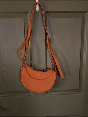 Crescent shaped crossbody bag